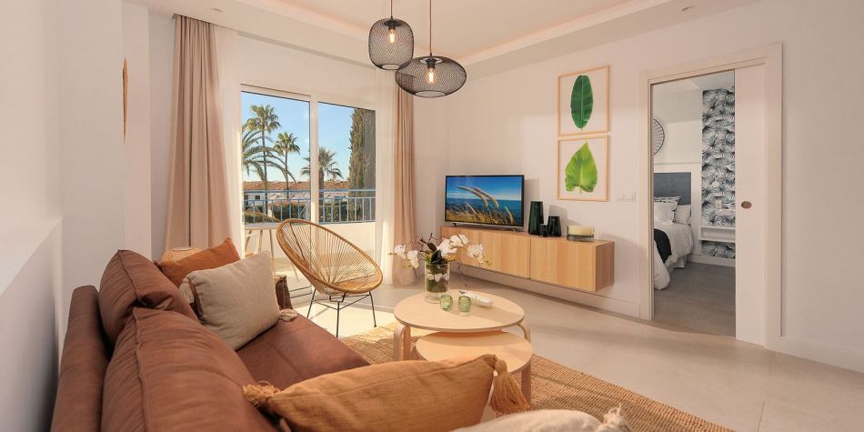 View of the living room and master bedroom - La Perla de Riviera show flat