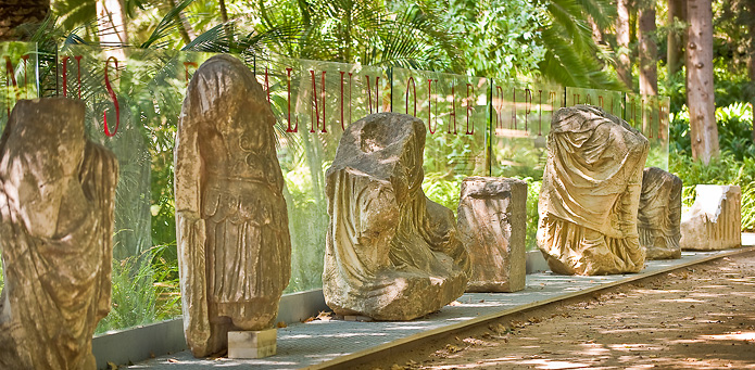 Roman sculptures flank the entrance to the Loring Museum