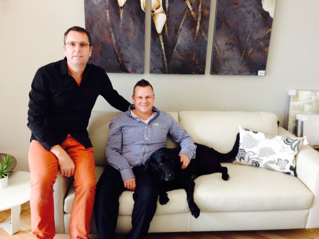 Partners David Gibson and Steve Dixon with pet labrador Ebony