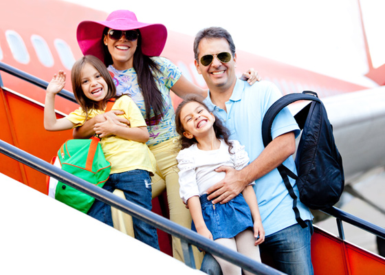 Family disembarking from plane