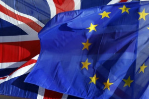 A British Union Jack flag and an European flag fly on the Amiens city hall during a a Franco-Britain summit in Amiens