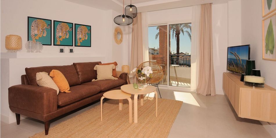 View of sofa and bright living room - La Perla de Riviera show flat